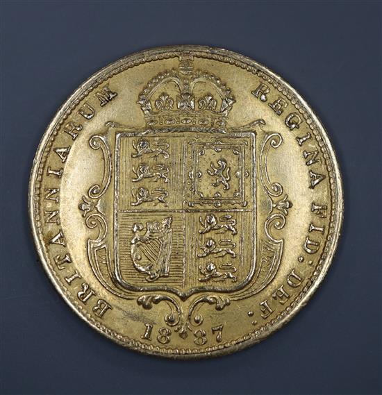 A Victorian 1887 gold half sovereign.